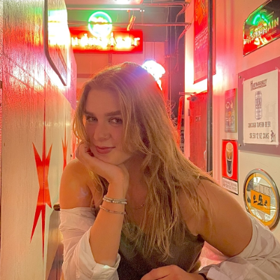 Julia Lemmon sitting bright cafe